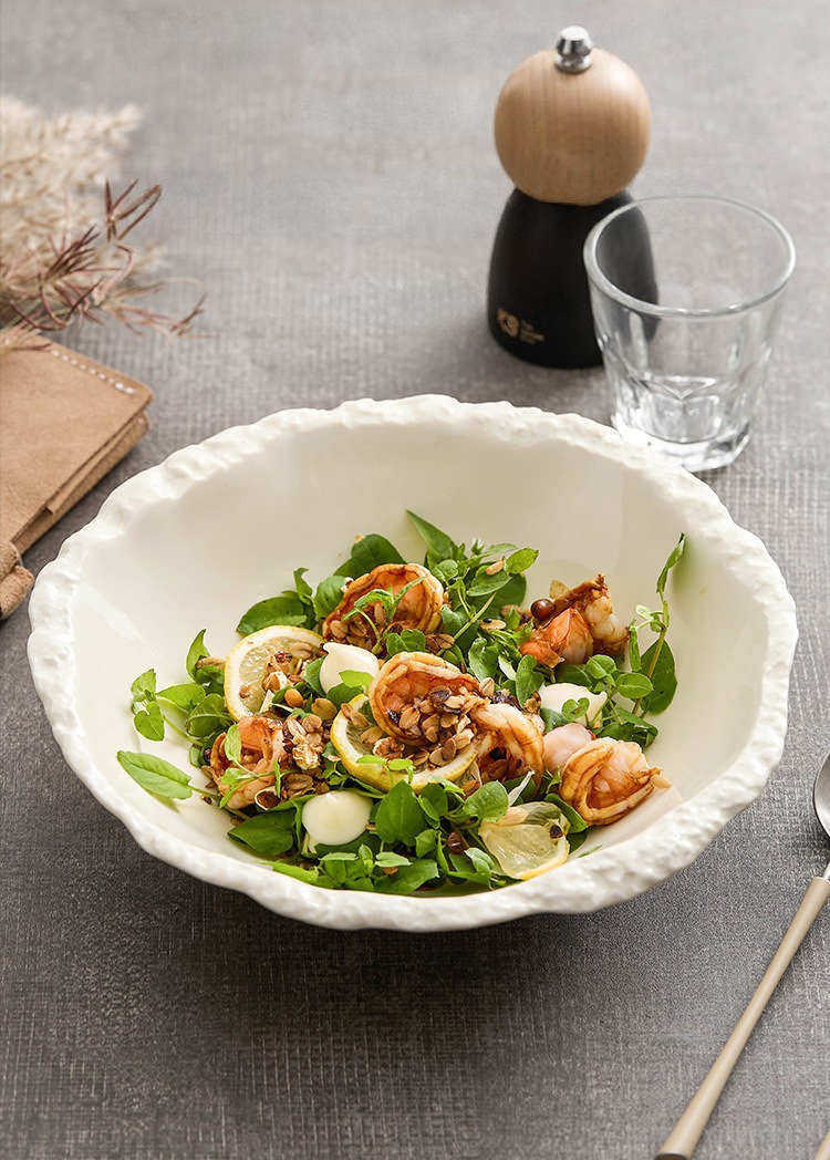 Elegant white bowl inspired by river stone textures.