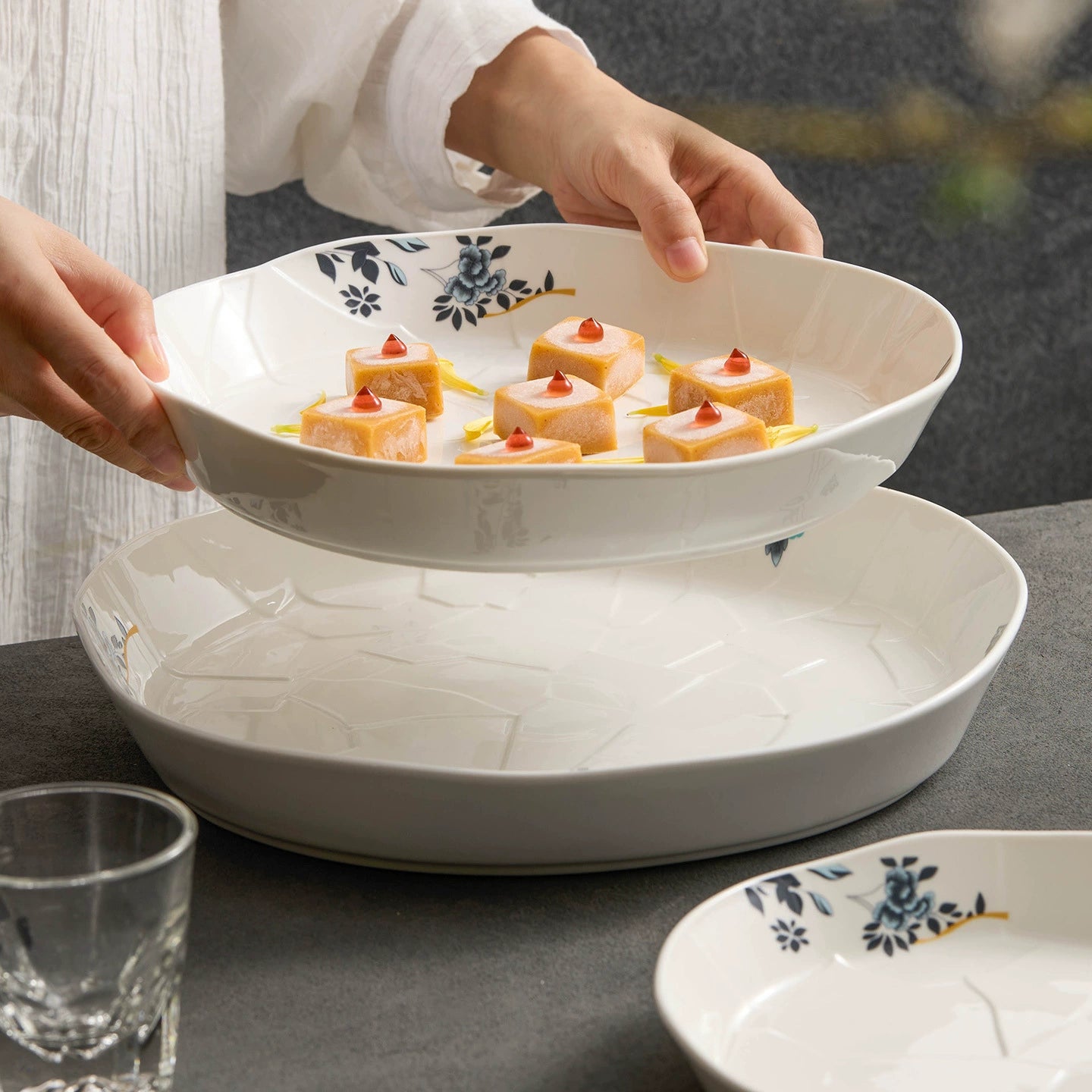 Elegant white ceramic plate with subtle floral accents.