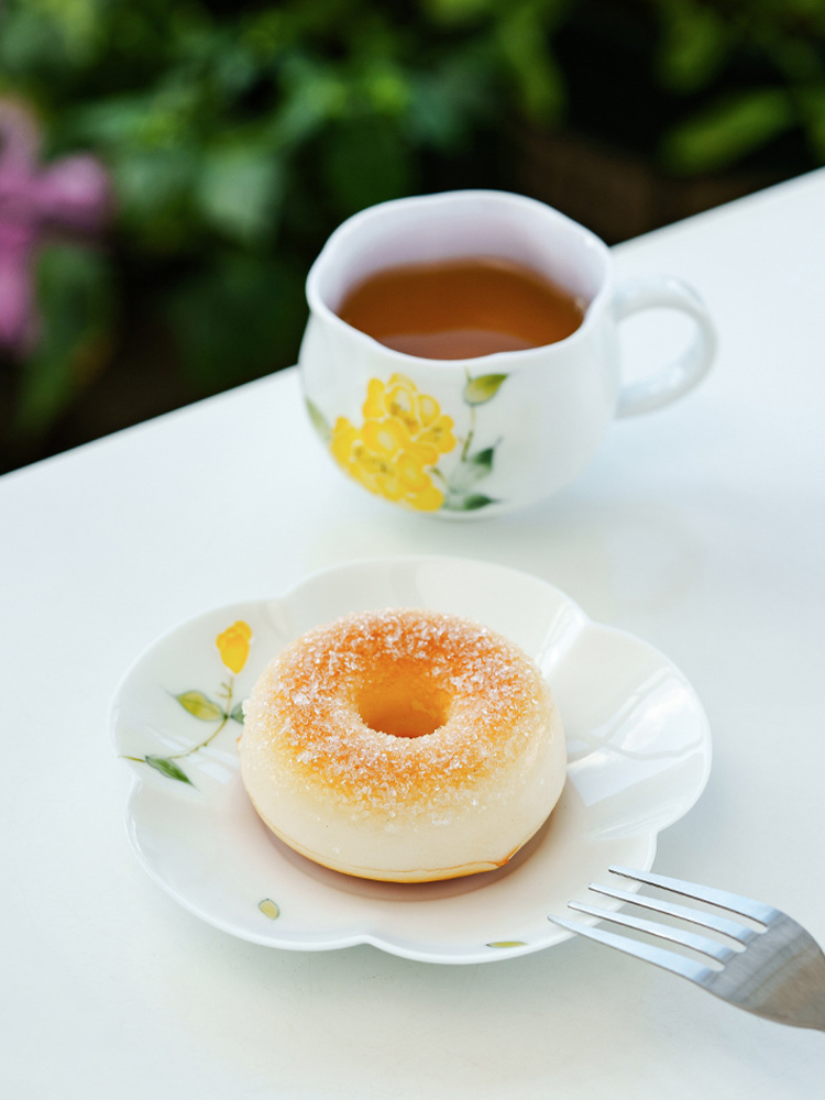 Elegant yellow flower cup and saucer for coffee or tea