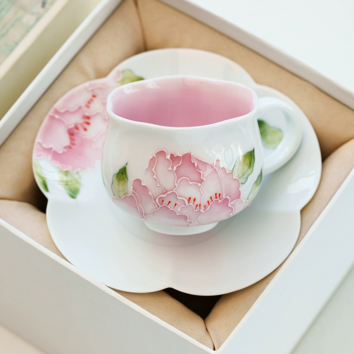 Fine china teacup with delicate hand-painted flower pattern