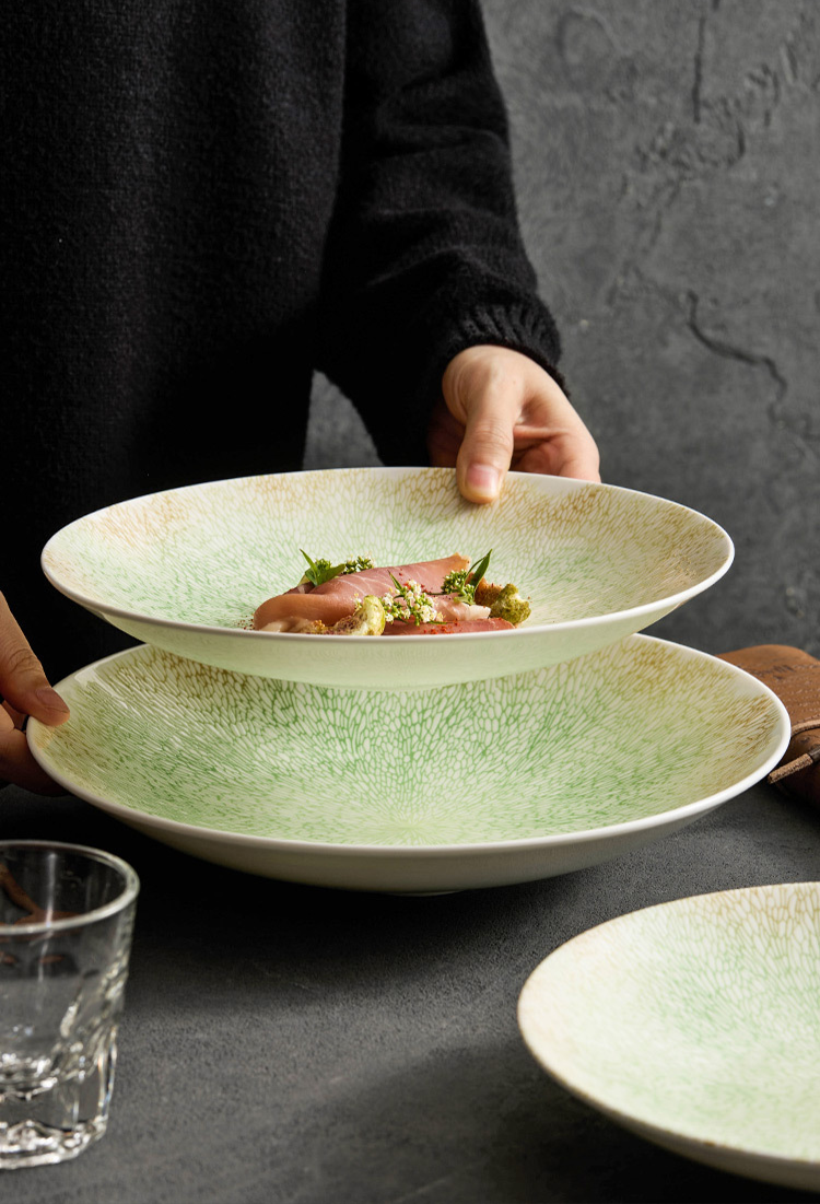 Fine dining bowl with curved rim and textured finish