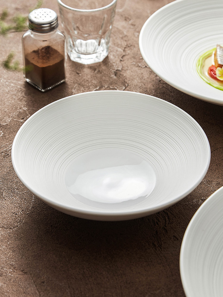 Fine dining ceramic serving bowl shown with gourmet plating