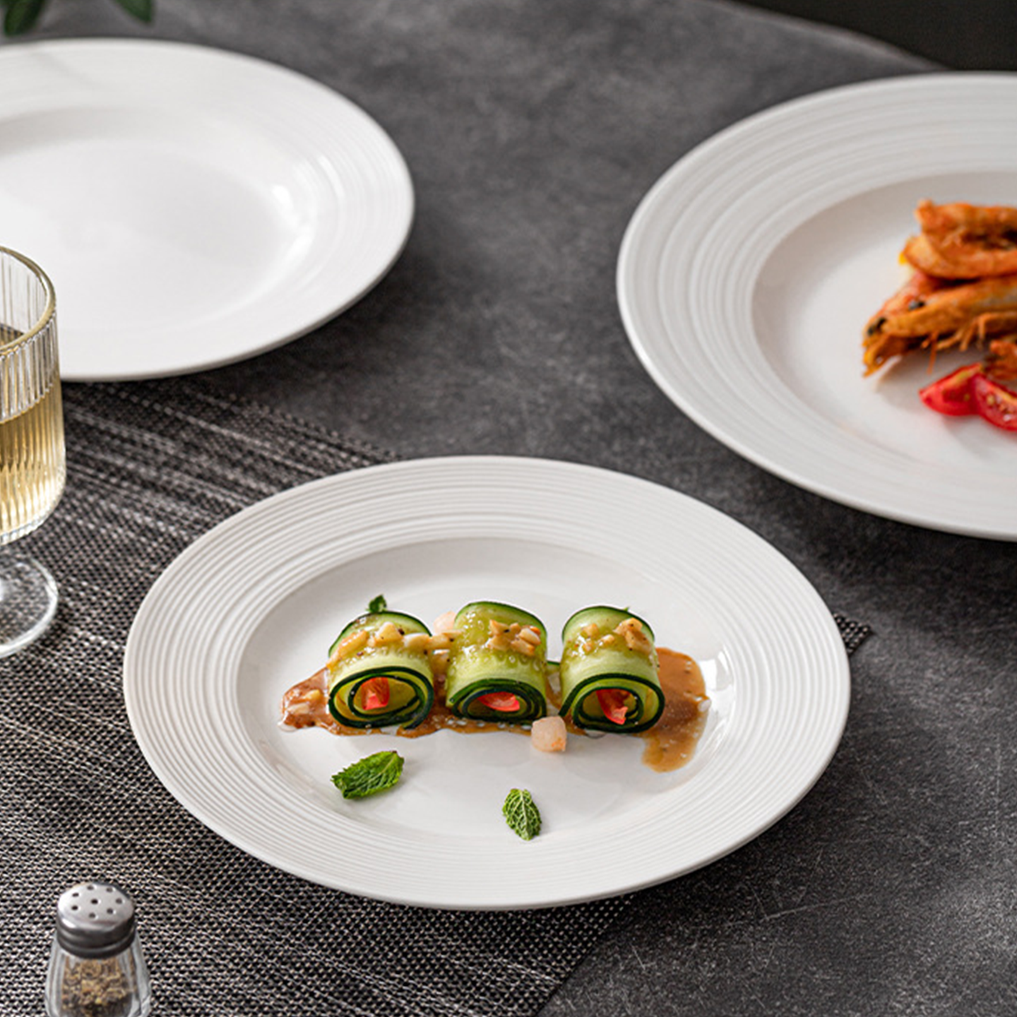 Fine dining shallow plate with subtle concentric texture