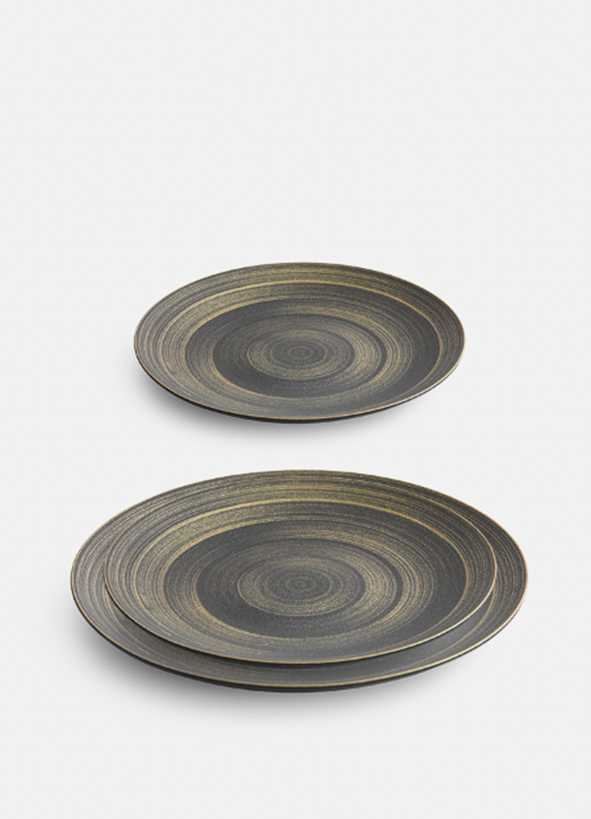 Fine dining tableware with gold swirl design and thick ceramic body