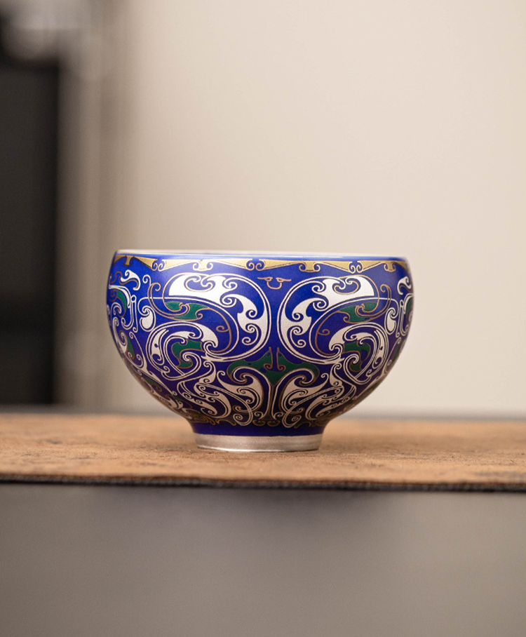 Fine porcelain master cup with detailed silver swirl pattern