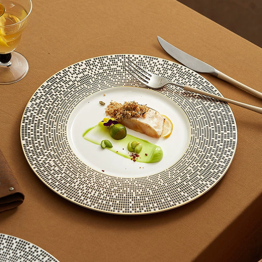 Fine porcelain plate with metallic patterned border