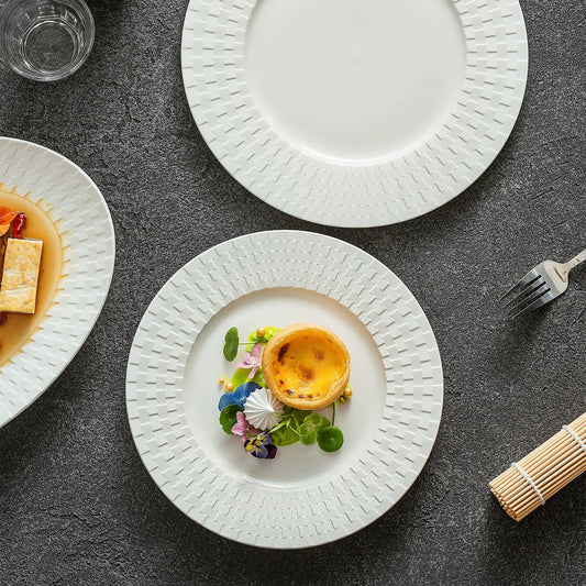 Flat ceramic plate with woven relief rim for refined plating