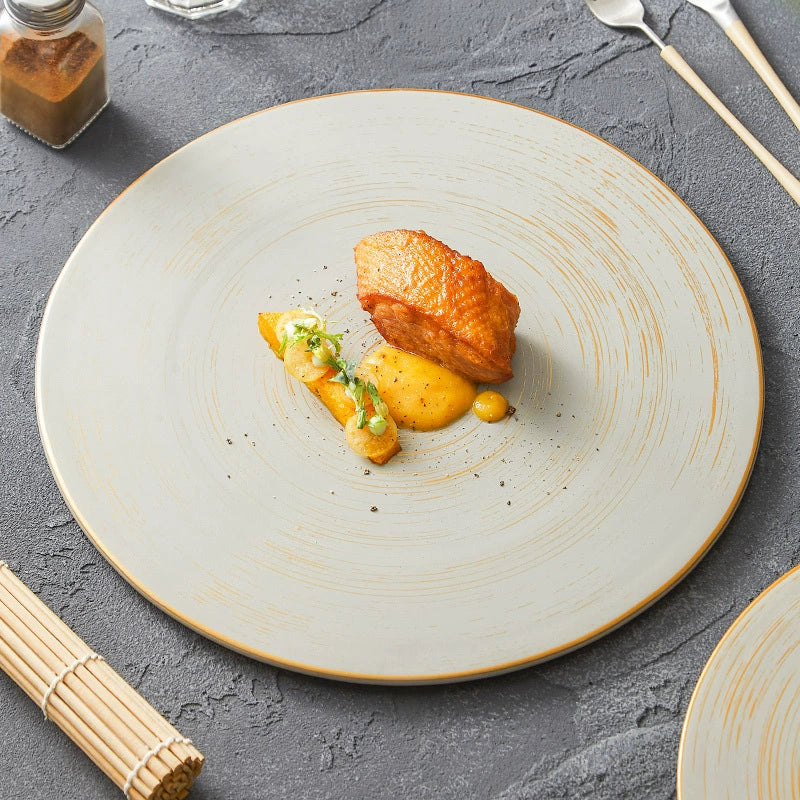 Flat ceramic tableware piece with minimalist look

