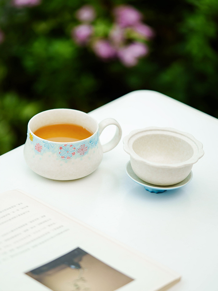 Floral ceramic tea cup with smooth glazed finish
