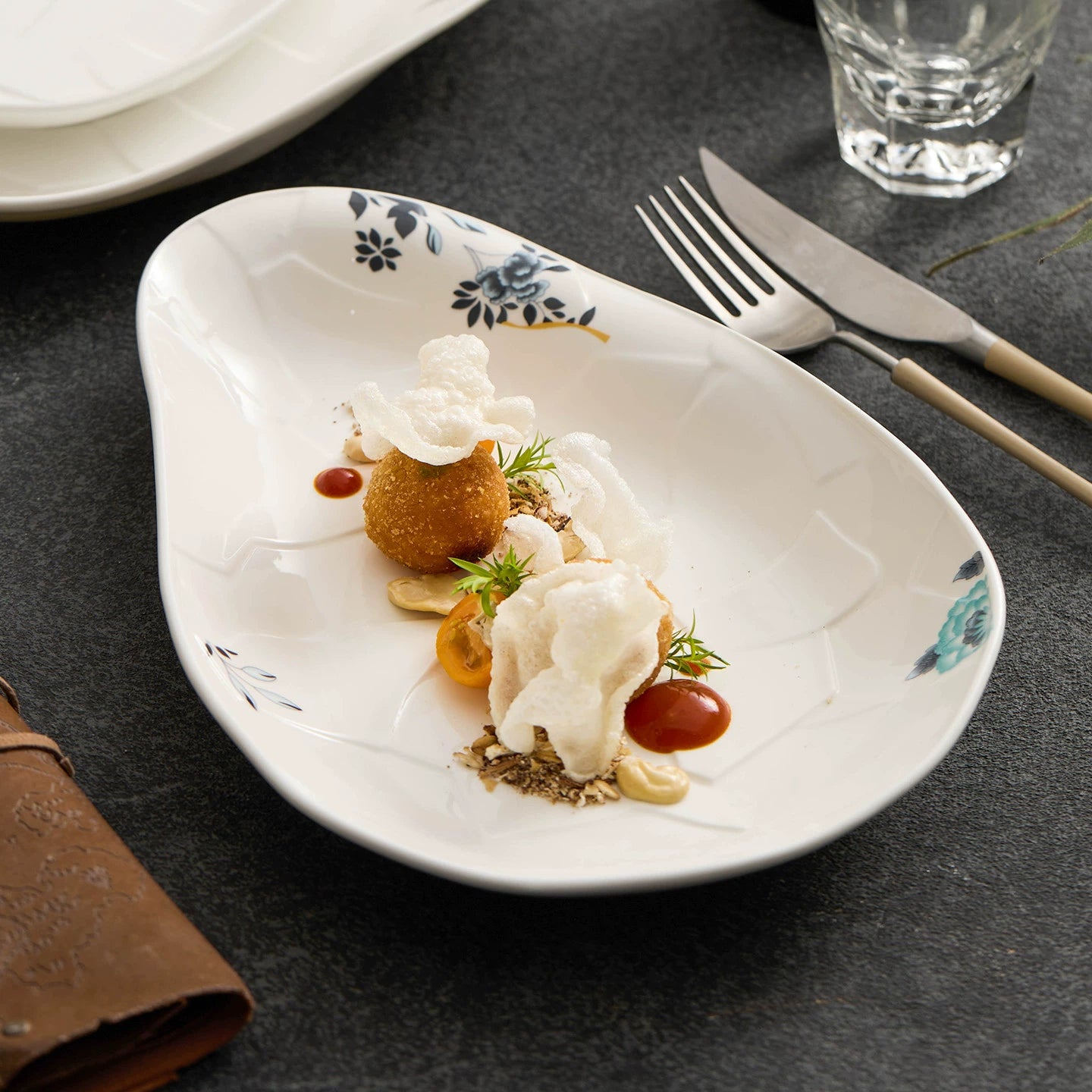 GOSEUNG Flowform porcelain plate with asymmetric organic shape.