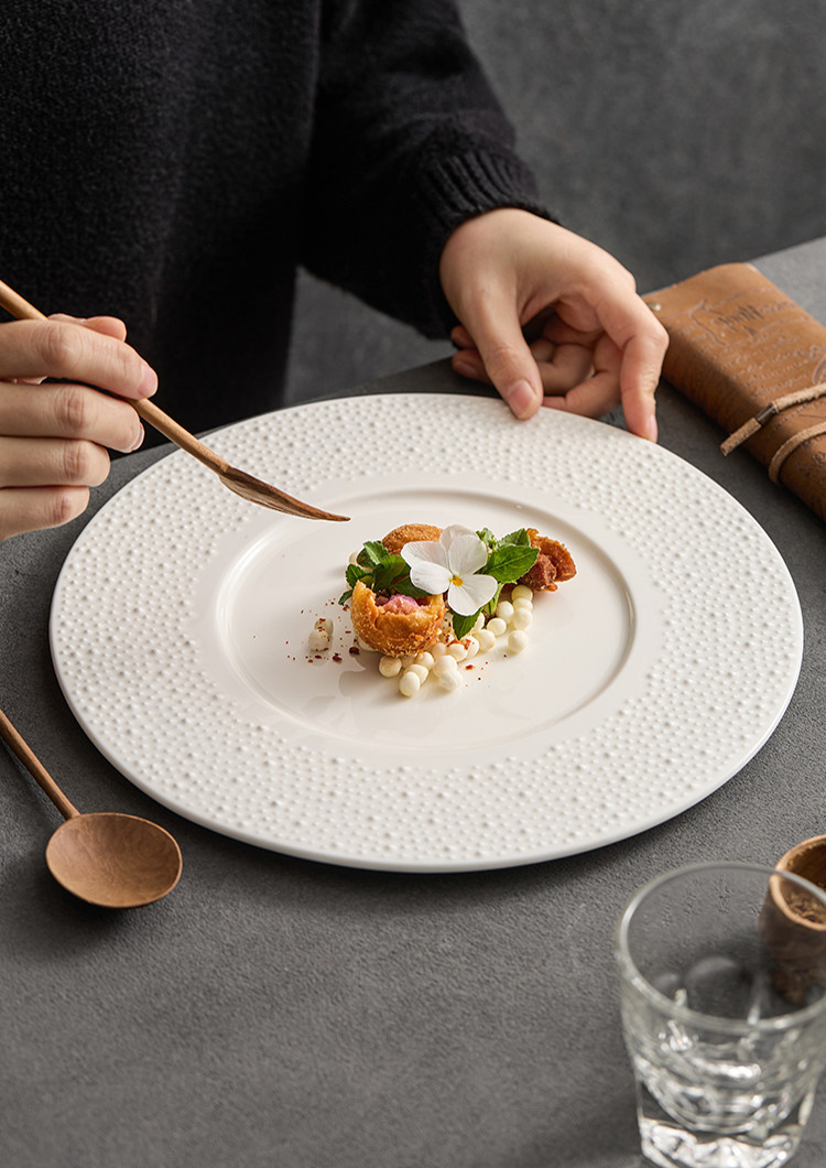 GOSEUNG artisanal ceramic collection featuring 10.5 and 12-inch textured plates.