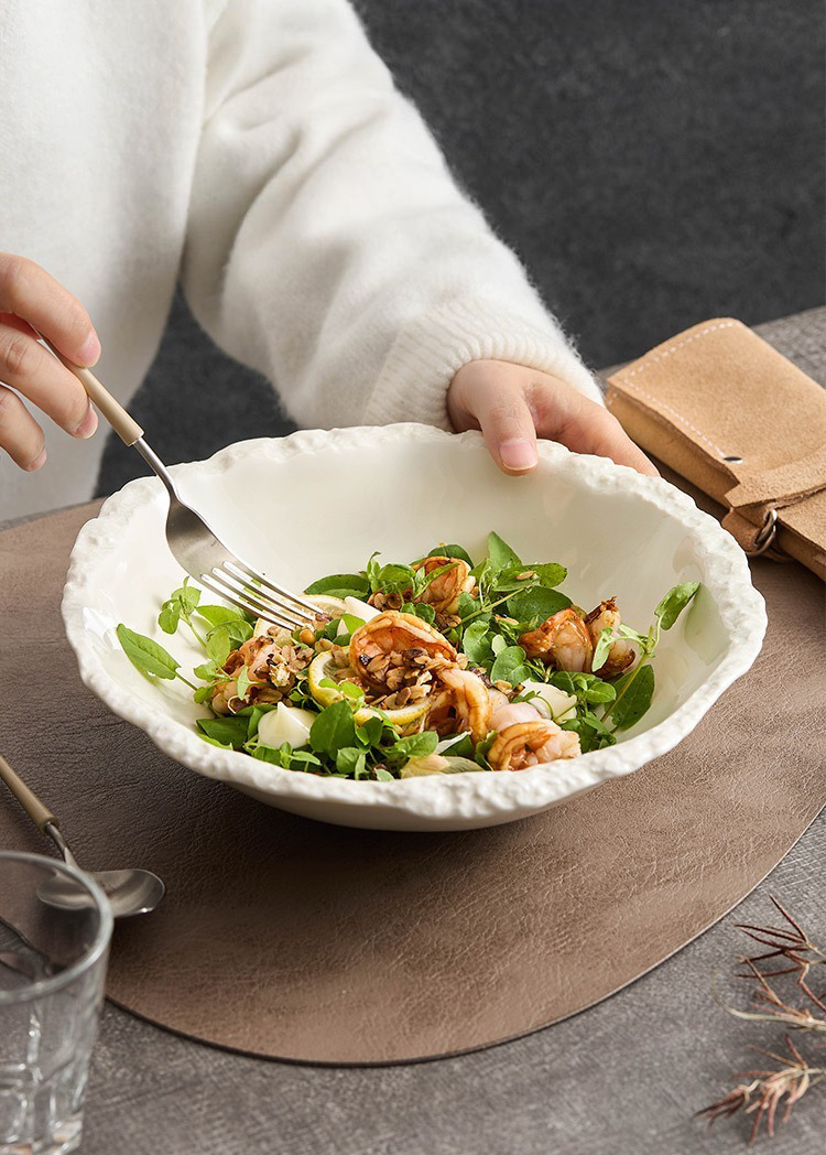 GOSEUNG ceramic serving bowl with rock-like contours.