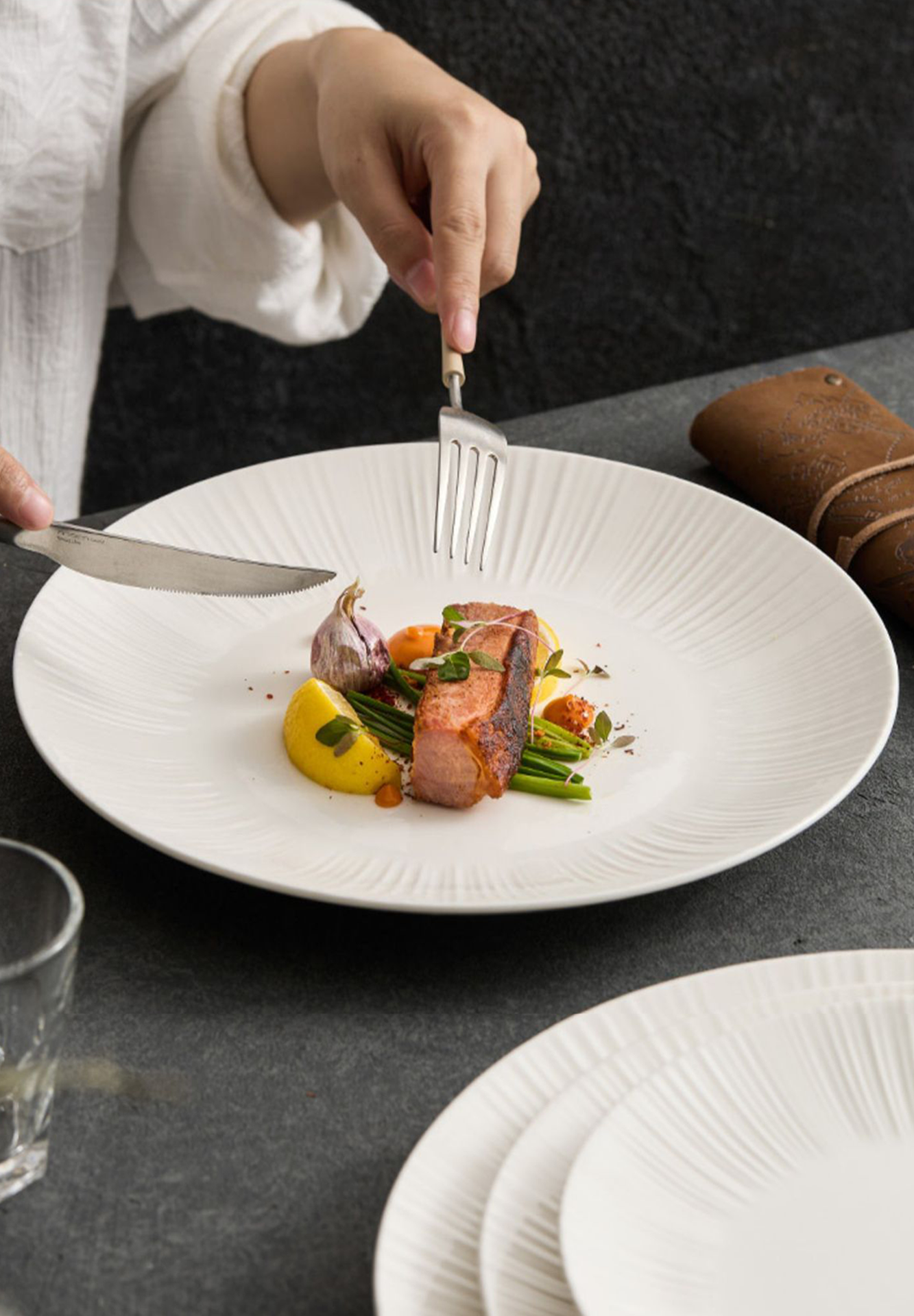 GOSEUNG porcelain tableware collection arranged on dining table.