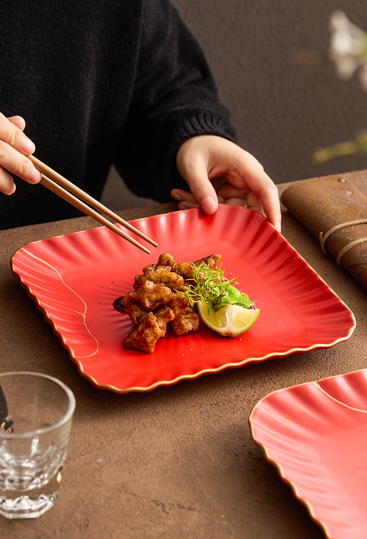 Glossy red ceramic serving plate