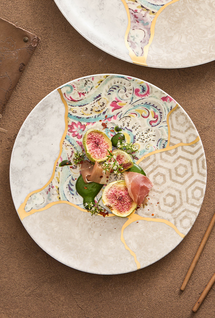 Gold-lined porcelain dinner plate with multicolor silk textures