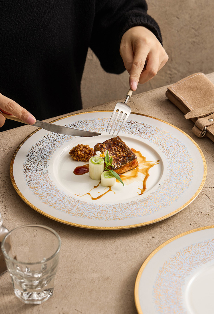 Gourmet dish served on sky-blue porcelain plate