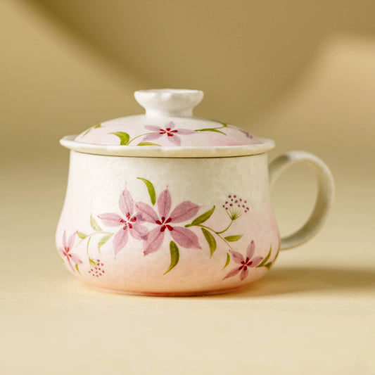 Hand-painted floral ceramic tea cup with lid