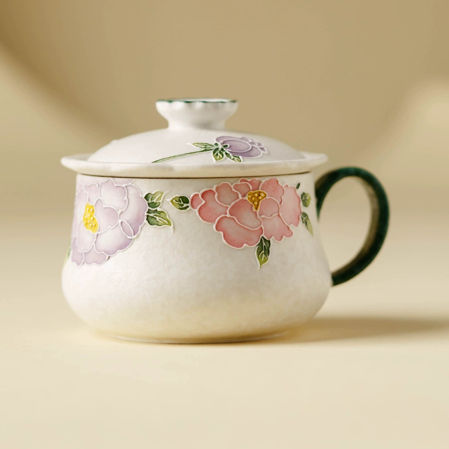 Hand-painted floral ceramic tea cup with lid