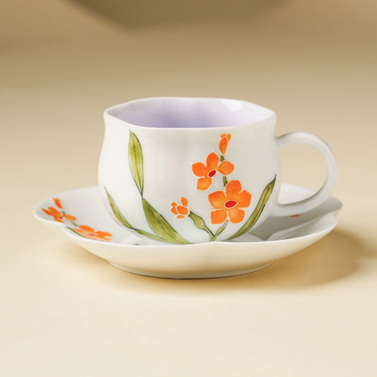 Hand-painted orange blossom porcelain teacup and saucer set