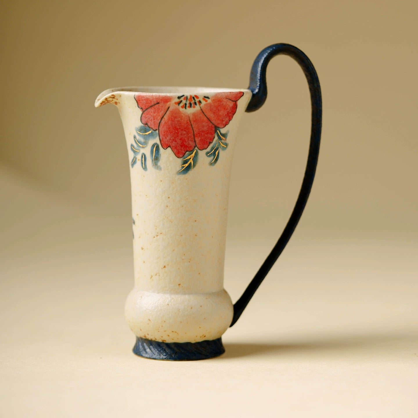 Hand-painted red floral ceramic fair cup with curved handle