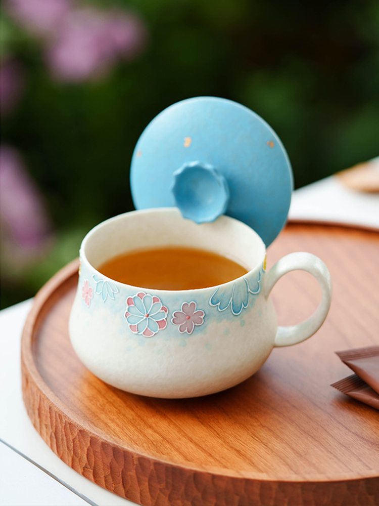 Hand-painted tea cup displayed with gift packaging