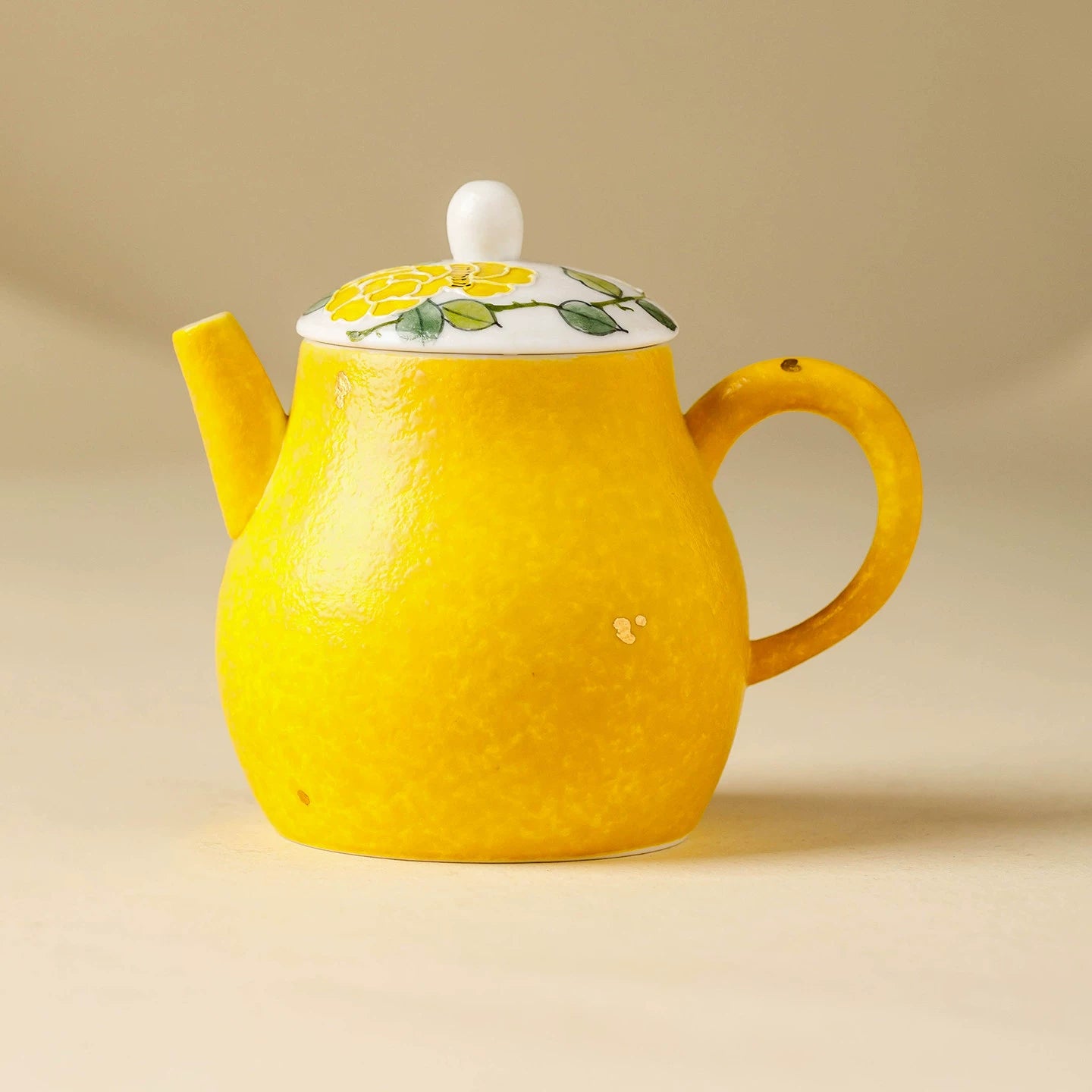 Hand-painted yellow blossom porcelain teapot with 125ml capacity.