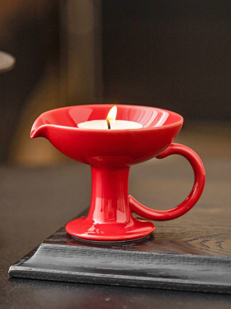 Handcrafted ceramic candle stand with ergonomic side handle
