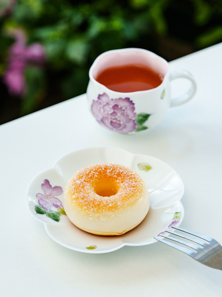 Handcrafted ceramic cup with lavender peony relief design