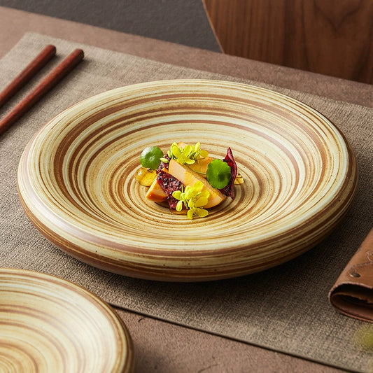 Handcrafted ceramic dinner plate with brown swirl pattern

