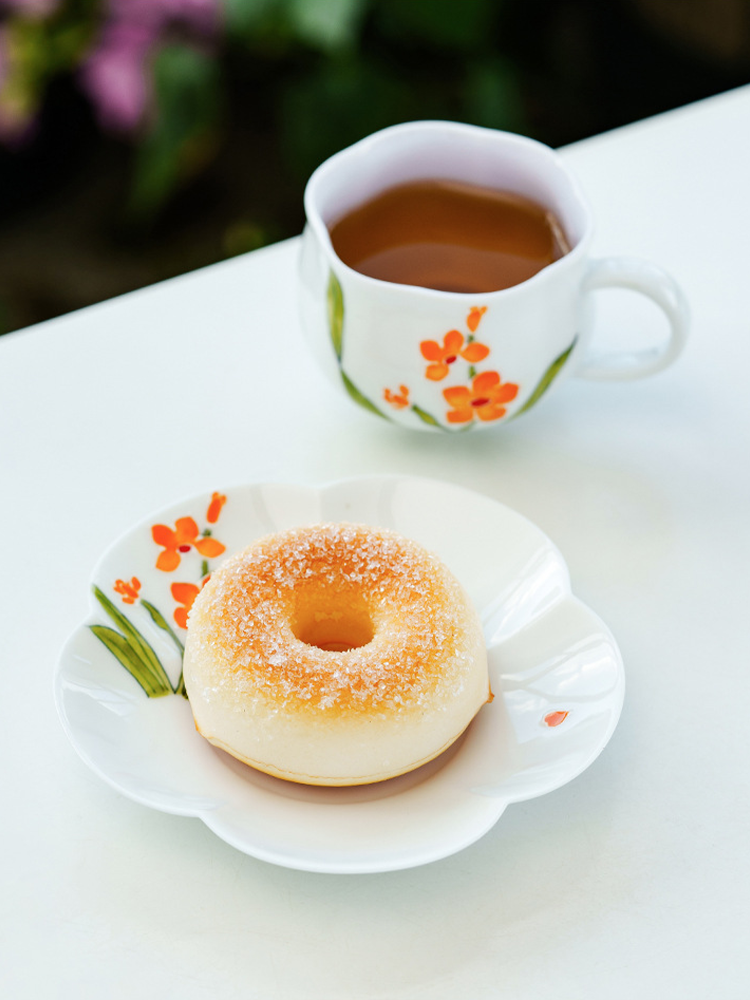 Handcrafted floral ceramic cup and saucer for tea or coffee