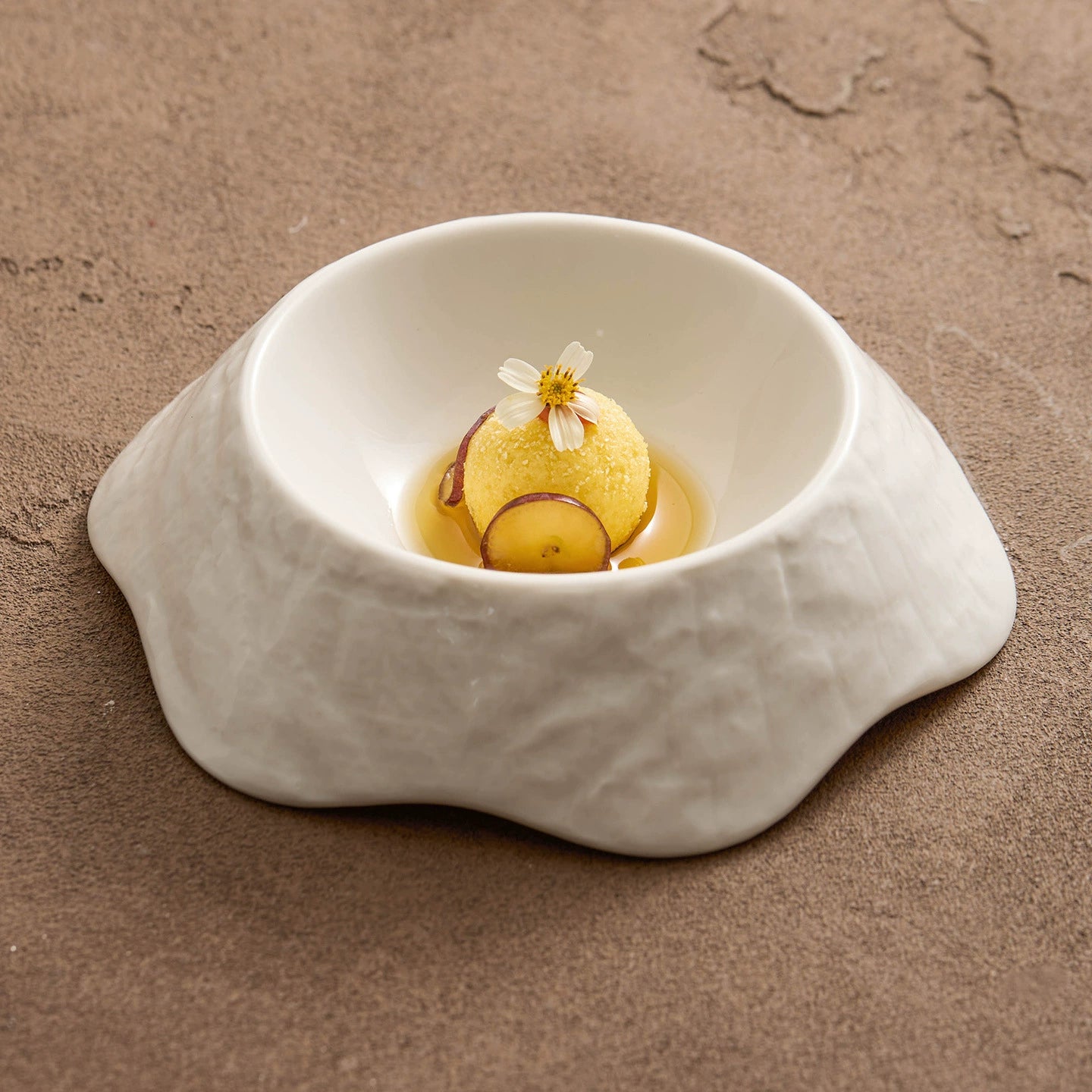 Handcrafted irregular ceramic bowl for fine dining presentation