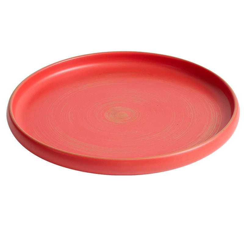 Handcrafted matte ceramic plate with raised rim and gold-brushed edge