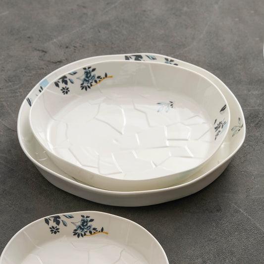 Handcrafted porcelain soup plate with natural cracked pattern.