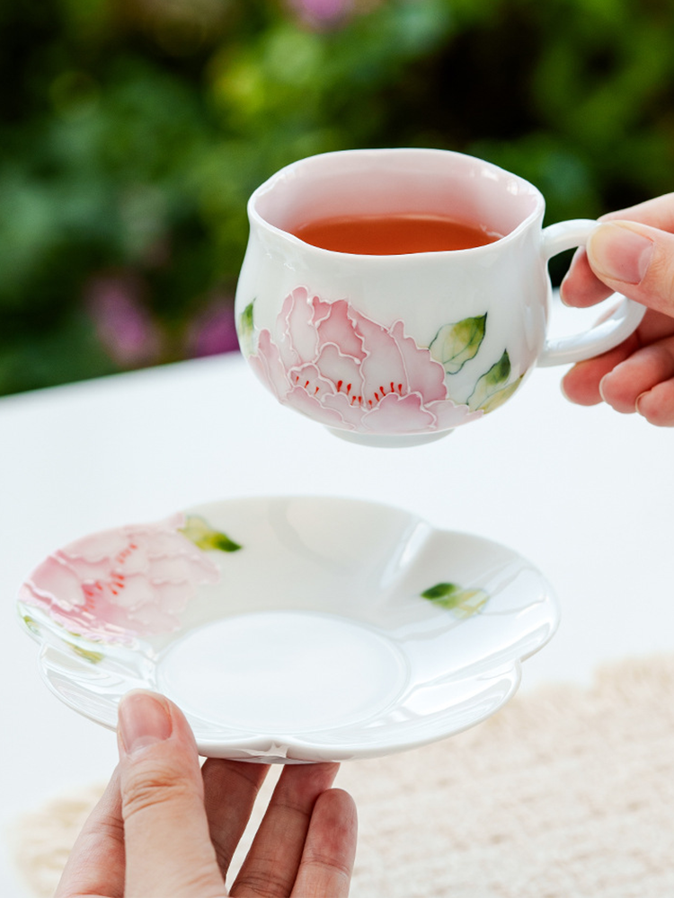 Handcrafted porcelain tea cup set with peony relief design