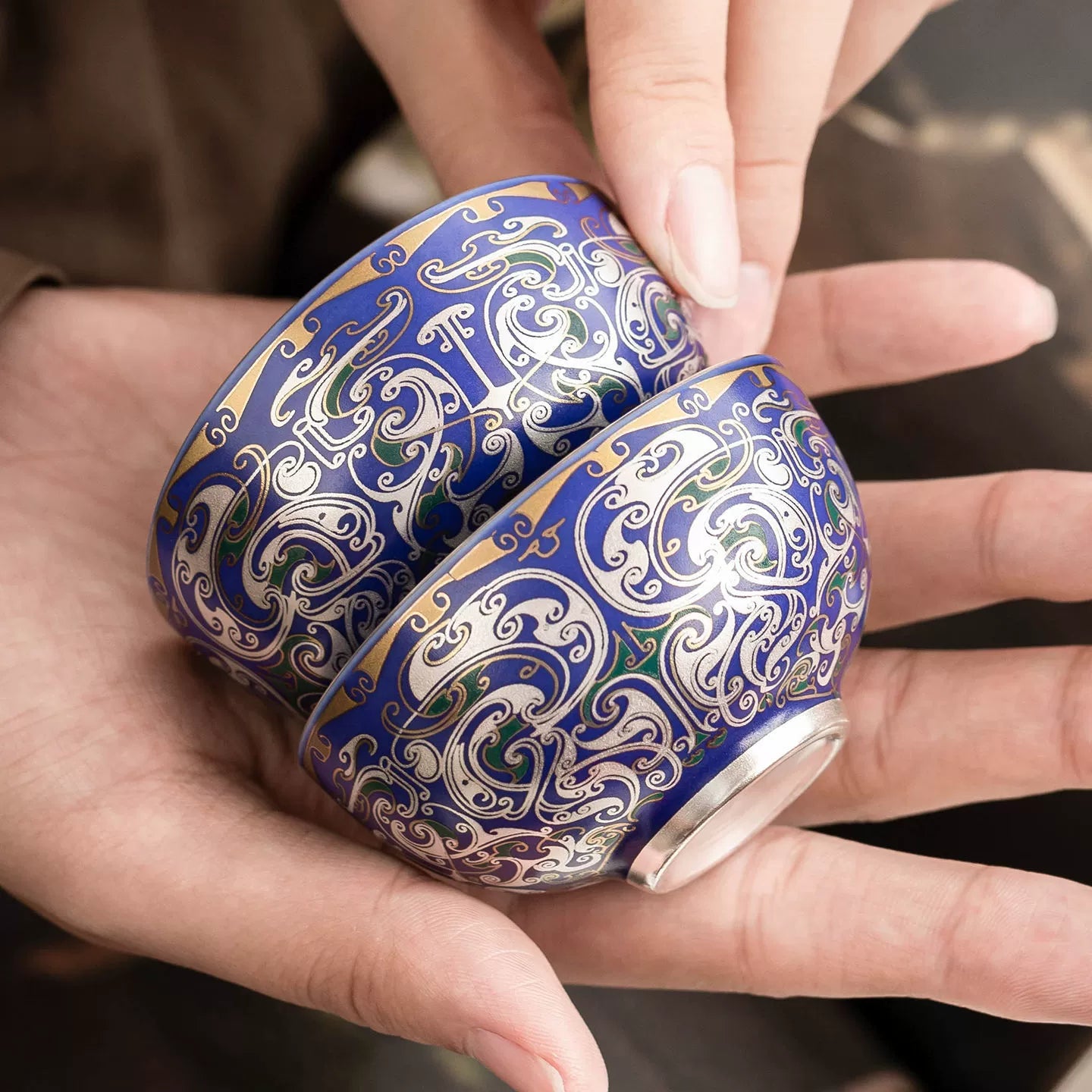 Handcrafted porcelain tea cup with 999 silver filigree detailing