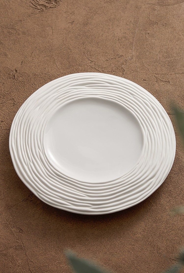 Handcrafted ripple-edge ceramic dinner plate for artistic plating
