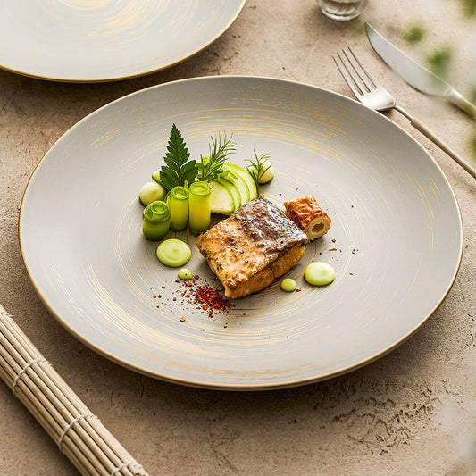 Handmade ceramic dinner plate with golden detailing

