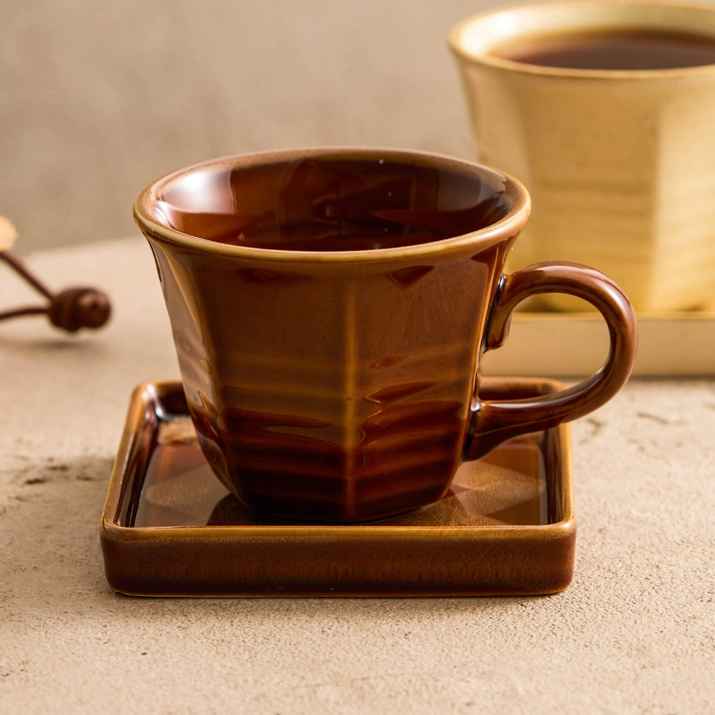 Handmade ceramic latte cup with matching square plate