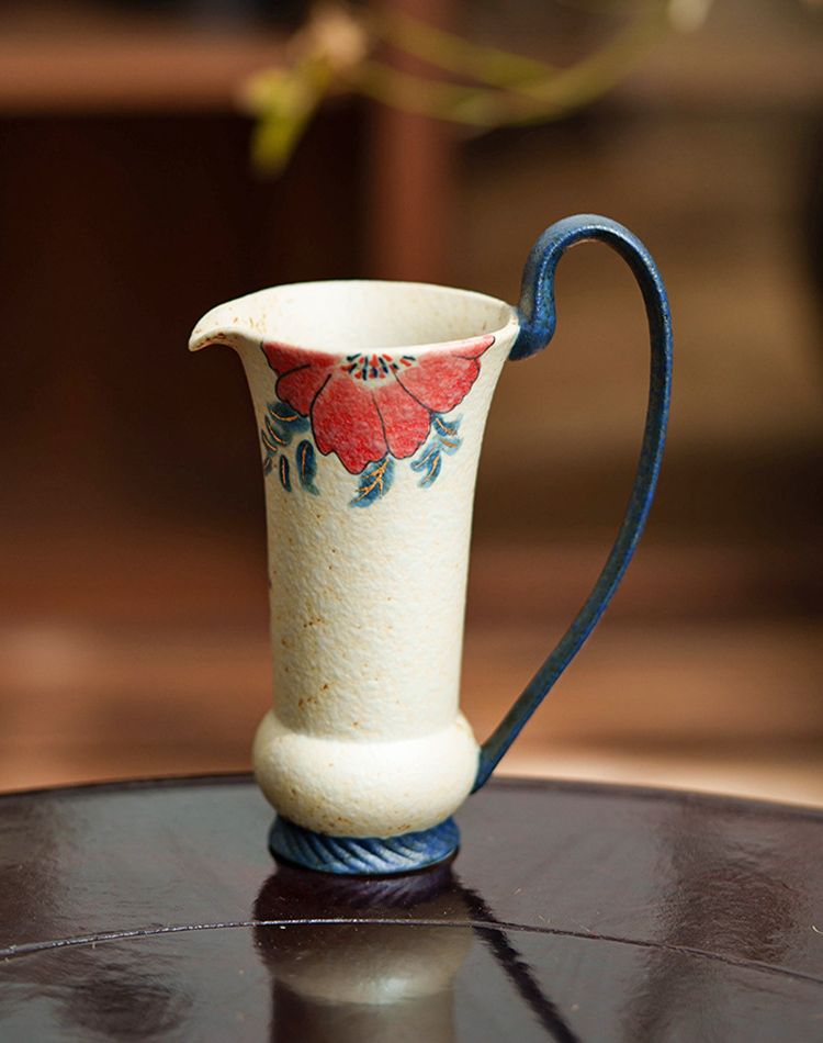 Handmade pottery pitcher for serving or display