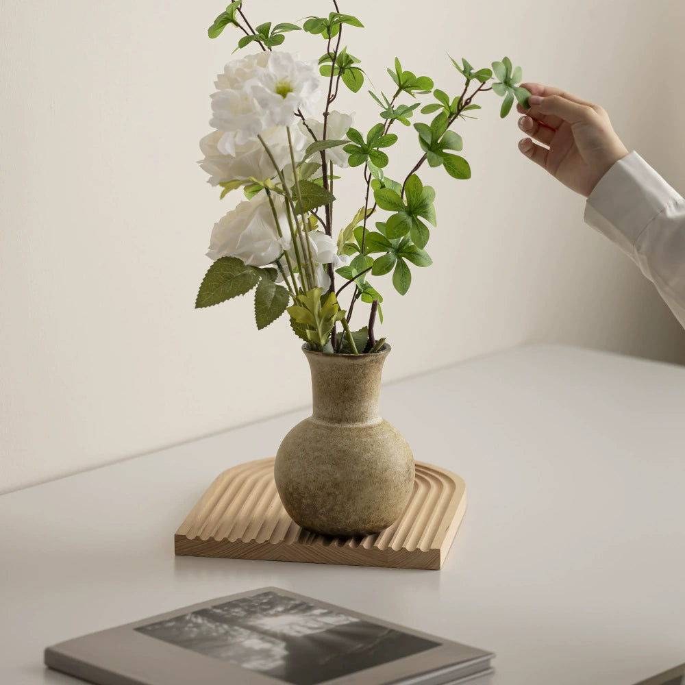 Handmade rustic ceramic vase with wide body and narrow neck