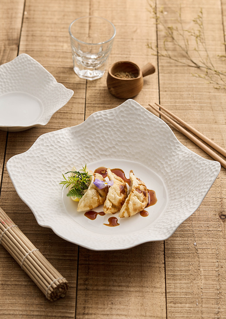 High-fired 30.5cm diameter irregular square plate for grand table service.