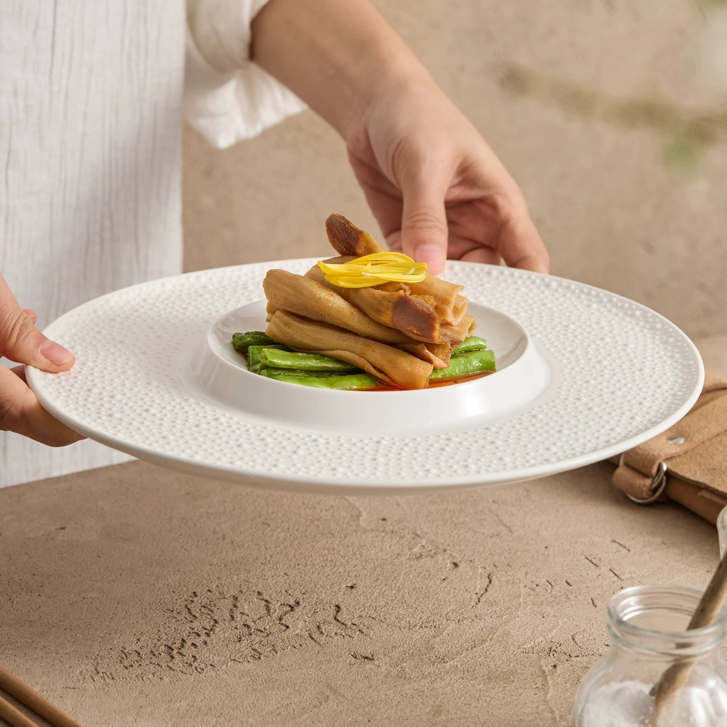 High-fired porcelain dinner plate with textured rim for restaurant and home use