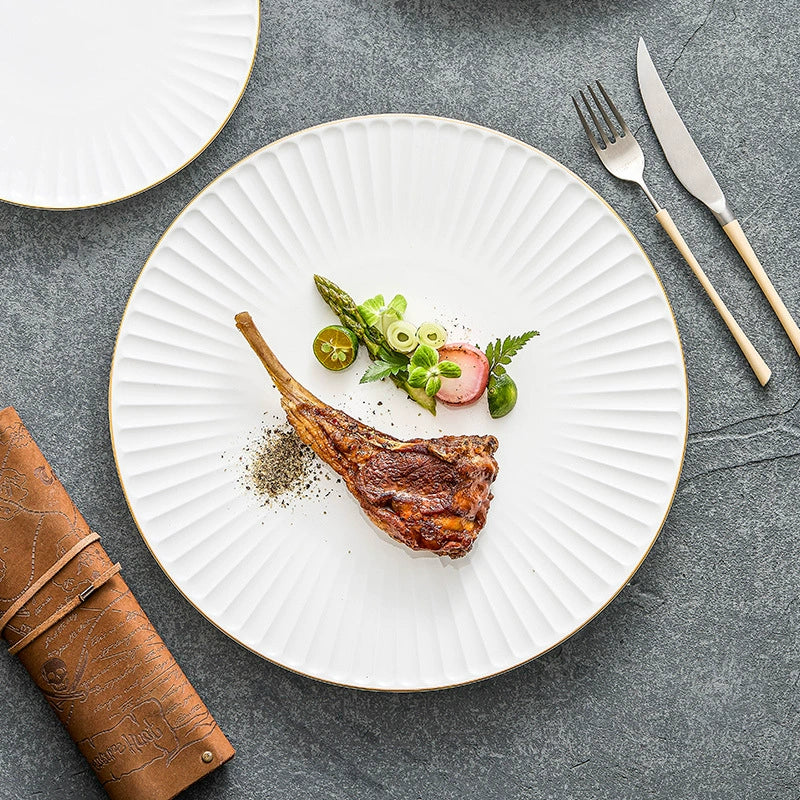 High-fired white ceramic dinnerware with gold accent rim