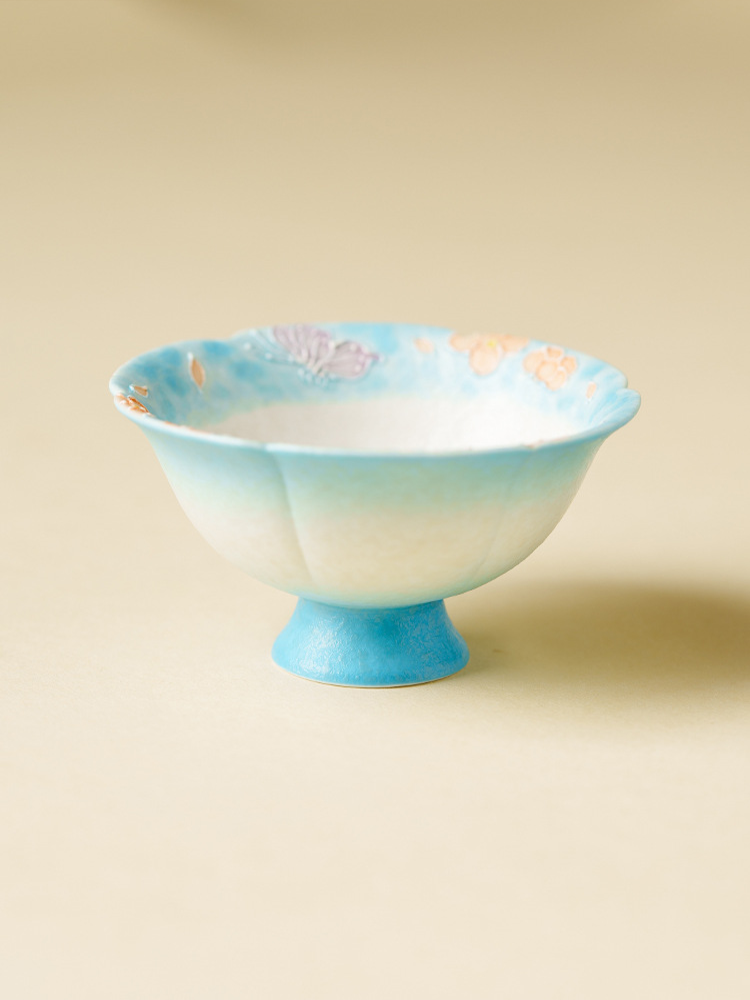 High-foot tea cup with floral rim design