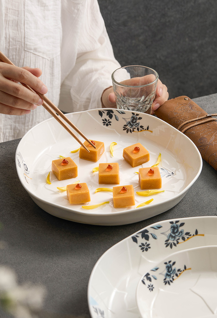 High-temperature fired ceramic plate with floral motif.