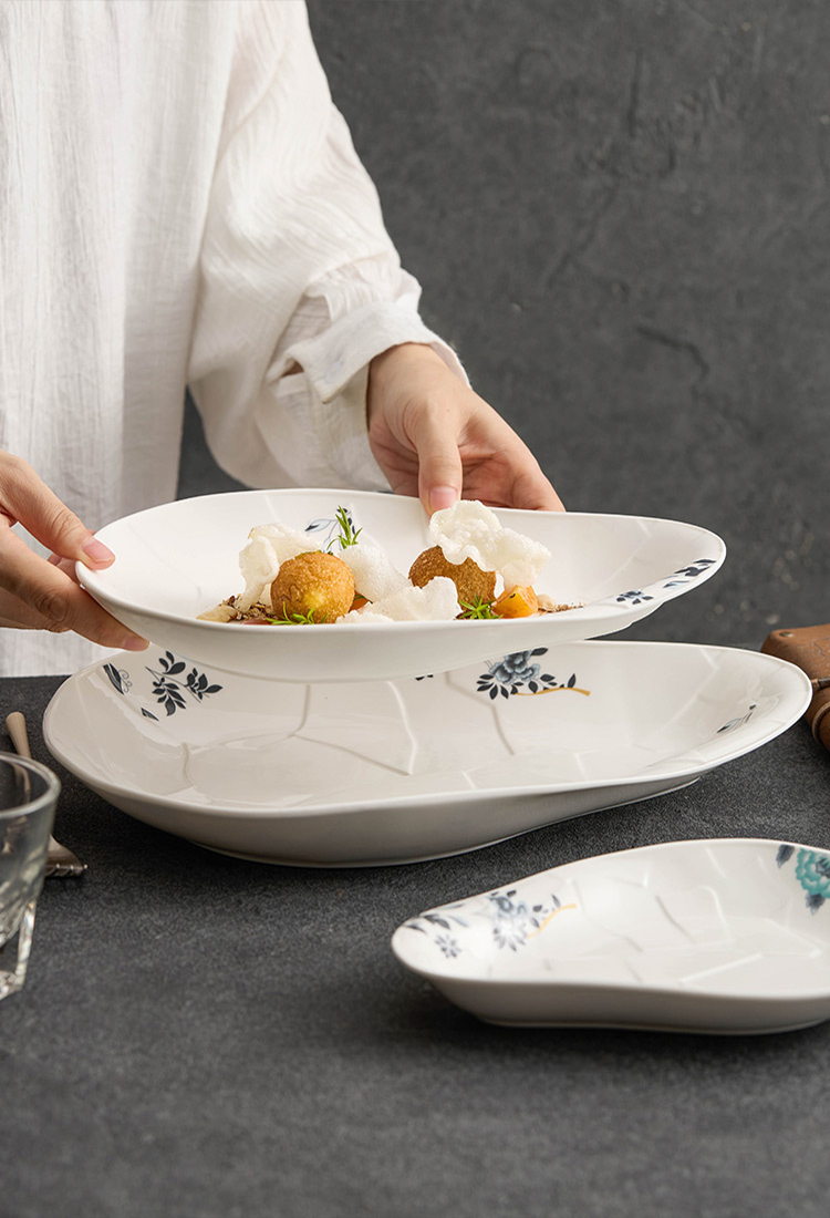 High-temperature porcelain art plate with organic flowform design.