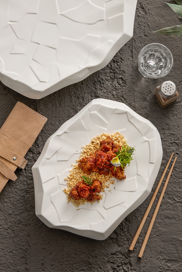 Irregular geometric plate showing cracked surface detail.