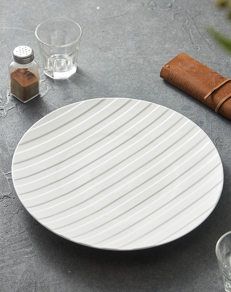 Japanese-inspired white ceramic plate for fine dining presentation