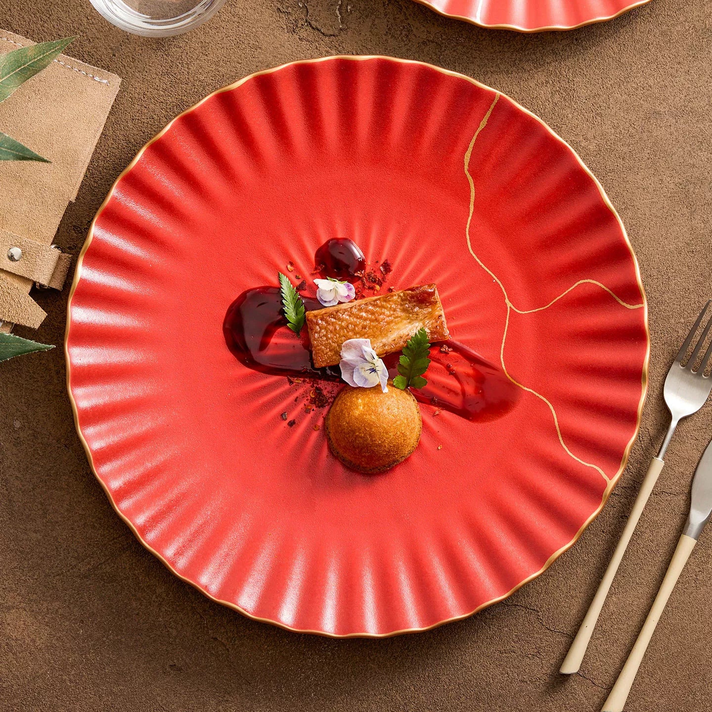 Red plate with a dessert on a brown surface