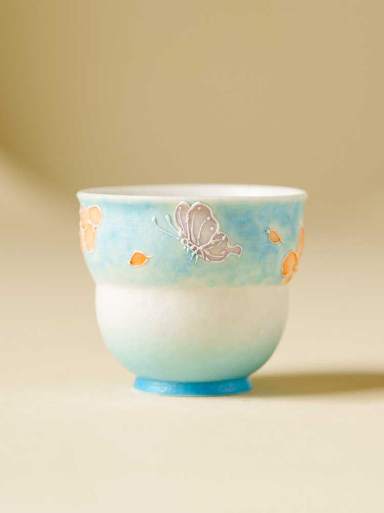 Lightweight hand-painted tea cup with floral details